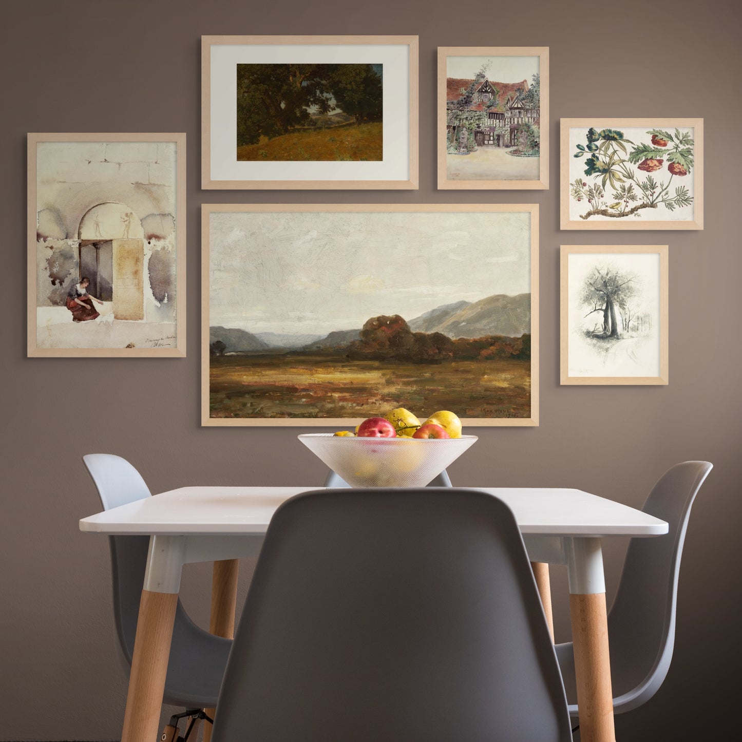 6-piece vintage gallery art set with warm landscape as the largest art piece, a woman petting a white cat, a shaded tree, a boudwin style home with a rusty red roof, poppies, and a sketch of a tree. Displayed above a kitchen table.