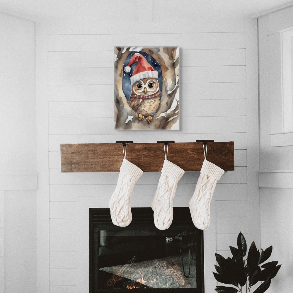Decorative wall art of an owl wearing a Santa hat above a wooden stocking holder with three white stockings.
