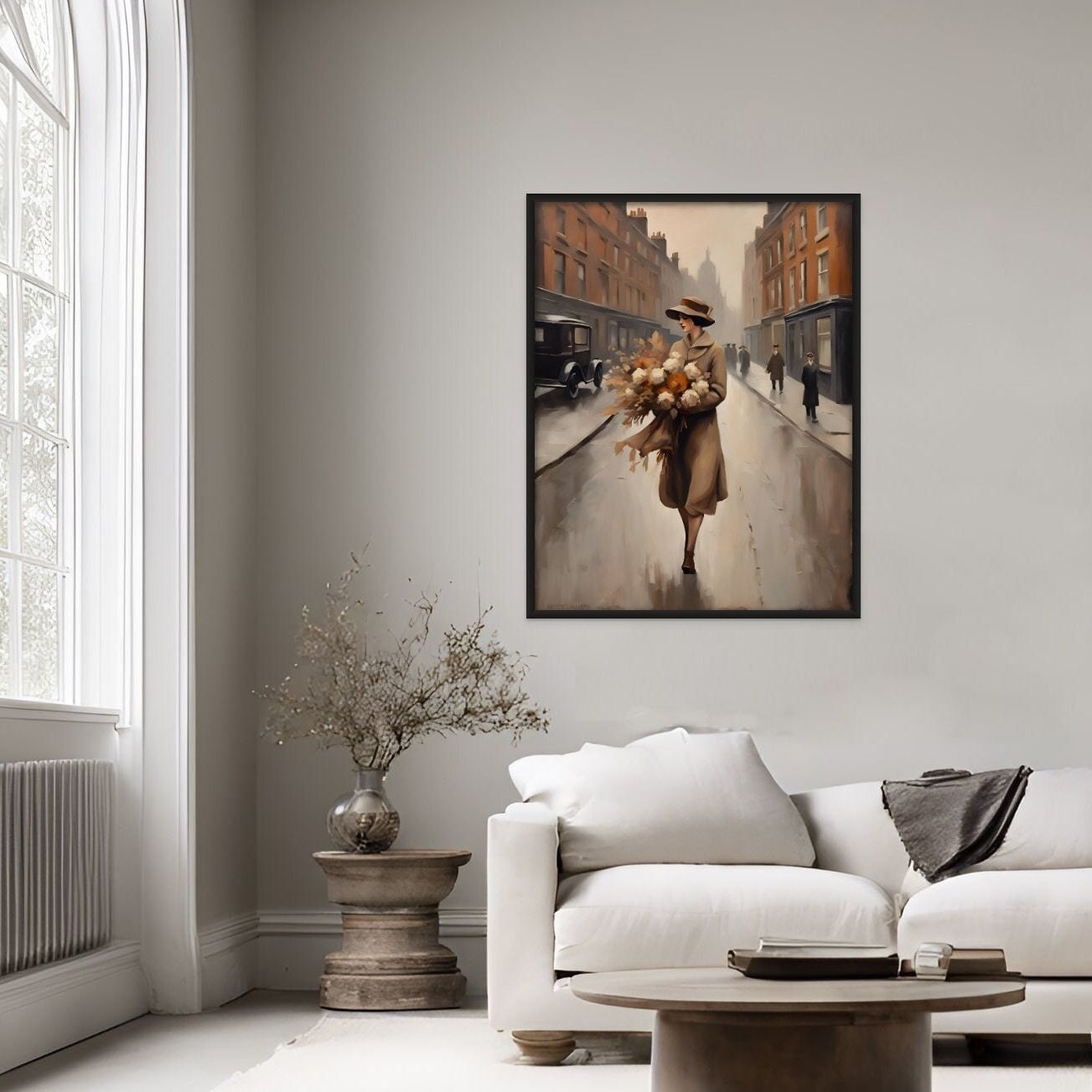Autumn colors displayed in a romantic scene of a young woman in the 20s holding a bouquet displayed abovve a white couch in a living room