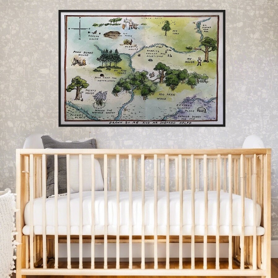 A Map of Pooh Bear's 100 Acre Woods displayed as artwork on the all over a crib in a nursery.