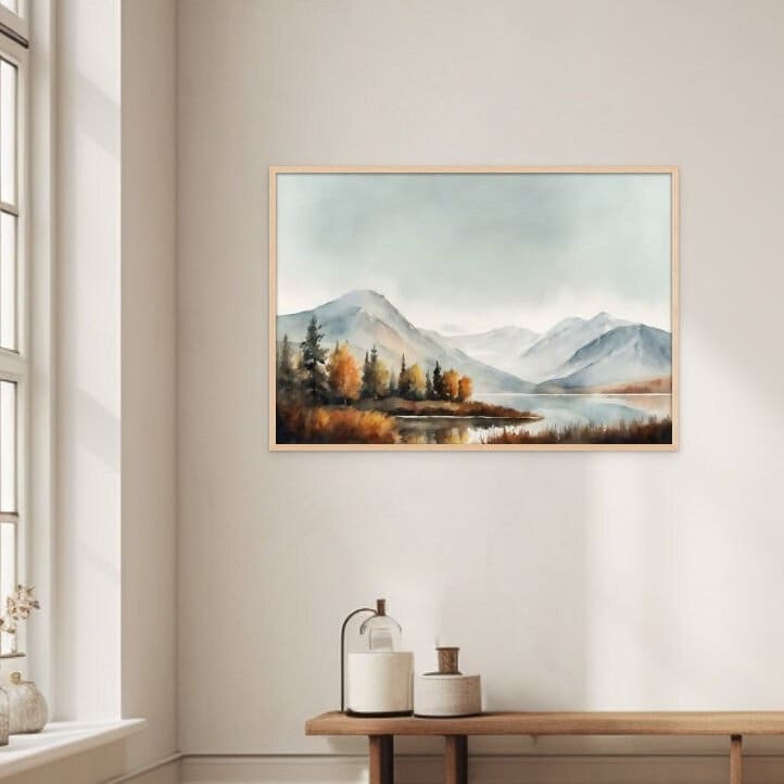 watercolor style painting of a lake during the autumn season. The trees and mountain reflect off of the lake. displayed above a wooden bench on a white wall