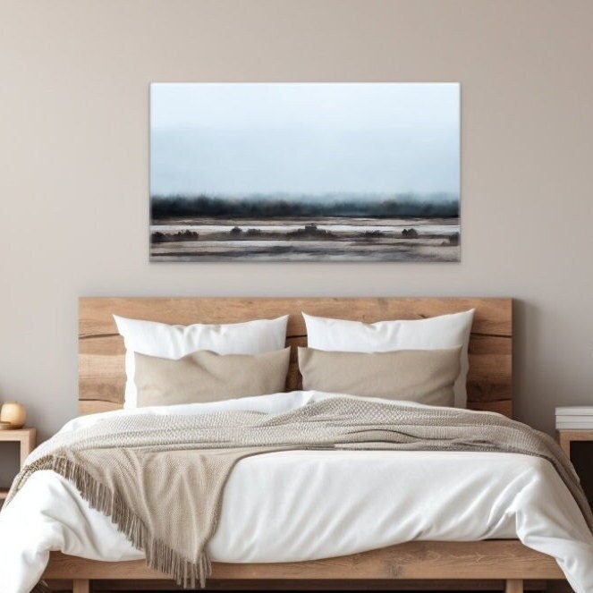 abstract style artwork of a Layered minimalist style field and sky. Taupe, grey and beige colors and light blue. displayed on the wall above the bed