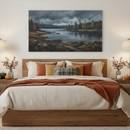 A large rectangular canvas print of a moody autumn lakeside landscape hangs above a wooden bed in a styled bedroom. The painting shows dark stormy skies, calm water, shoreline reeds, and trees with orange and brown foliage.