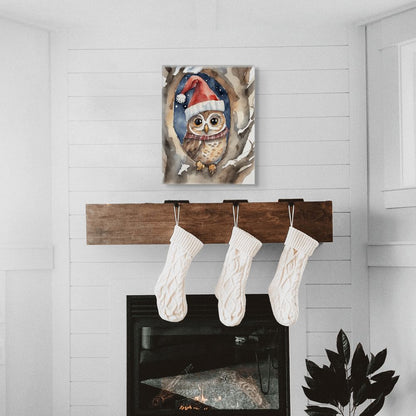 Decorative wall art of an owl wearing a Santa hat above a wooden stocking holder with three white stockings.