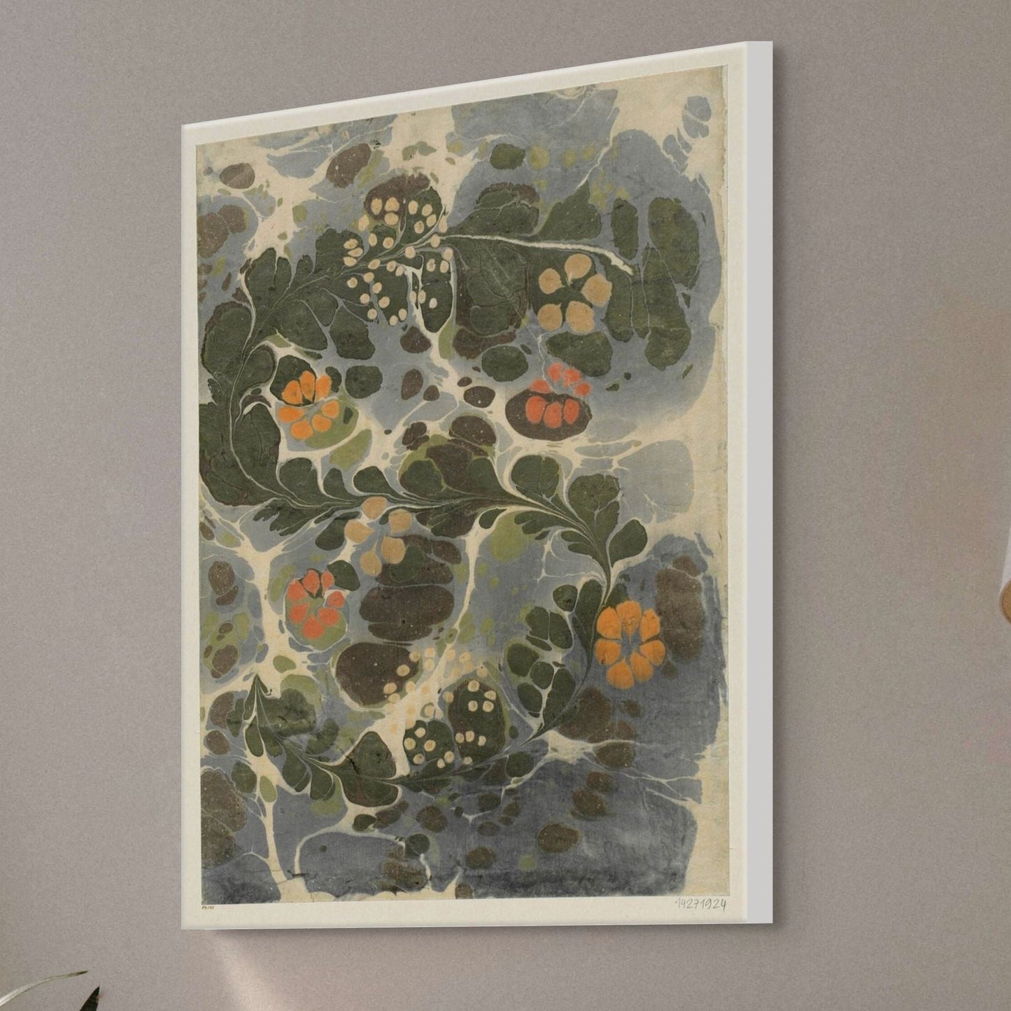Framed floral artwork on a gray wall