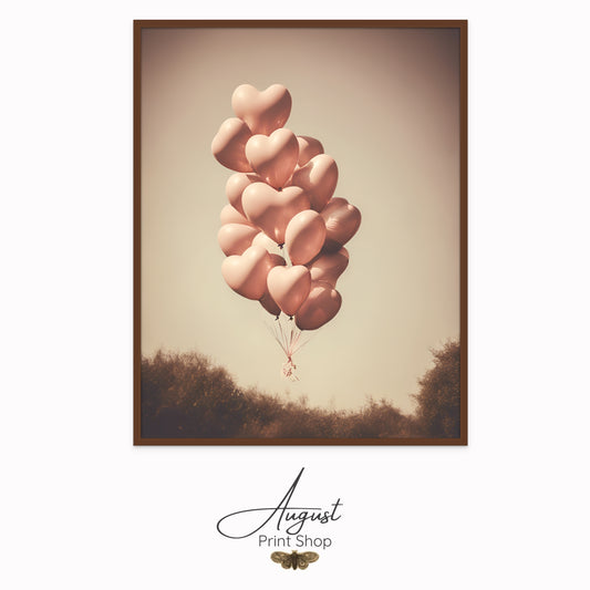 Vintage style photograph of heart shaped balloons. Featuring soft pink balloons floating away in a polaroid style photo.