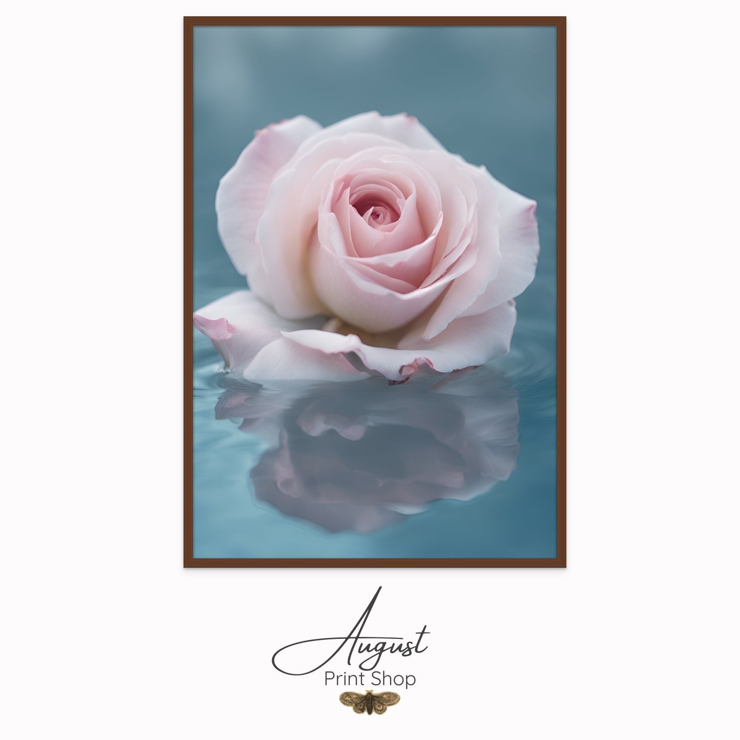A unique photograph of a soft pink rose floating in soft blue water. It's reflection can be seen in the serene water. 