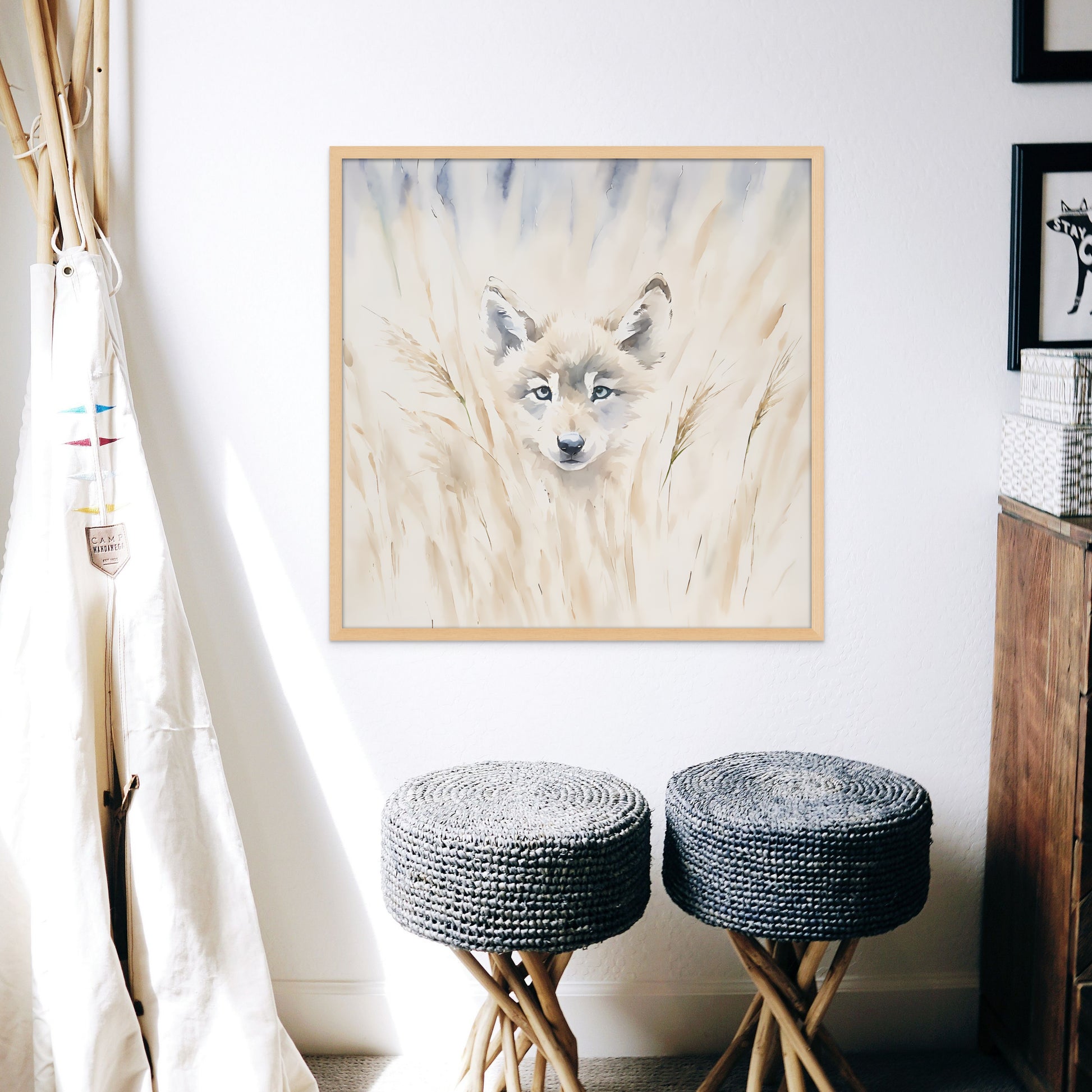 A soft and adorable watercolour painting style print on canvas of a brown bear cub hiding in the tall, pale grass.  displayed on the wall in a childrens room