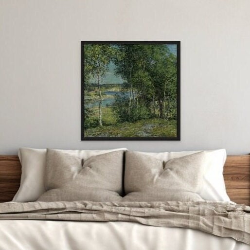 A print of the vintage oil painting by Willard L. Metcalf. Displaying a deep green birches in summer. Displayed on the wall above a bed.