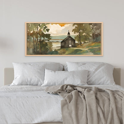 Black church artwork in a natural frame above a white sheets bed