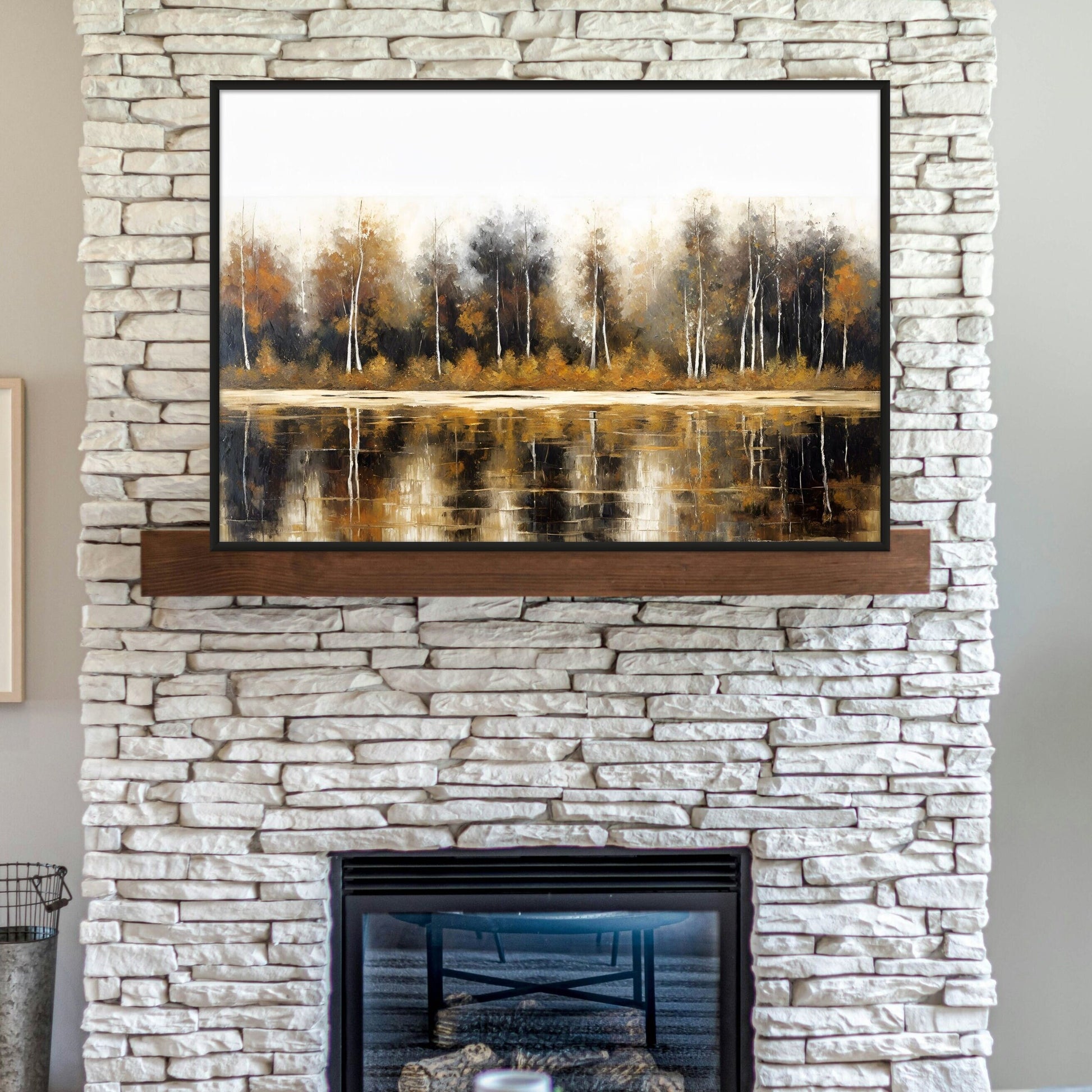 subtle fall colors artwork displayed above a fireplace on white brick